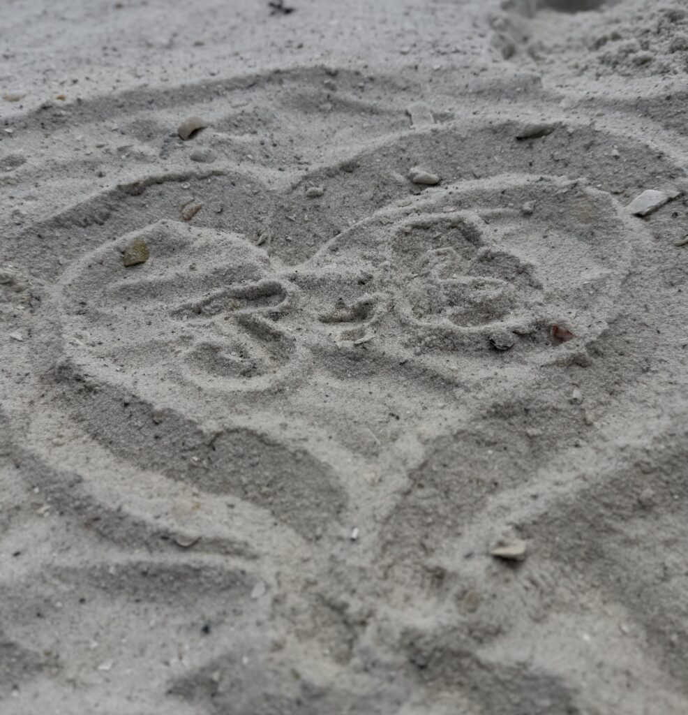 heart drawn in the sand