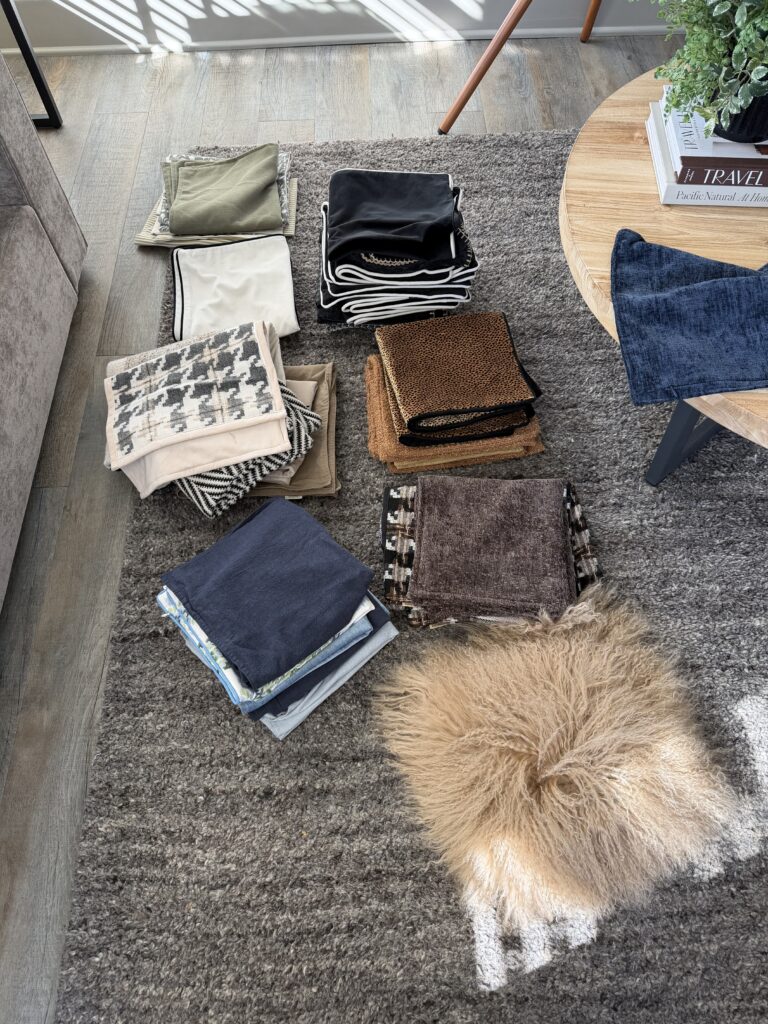 Pile of pillow covers laying on floor allowing for change in decor
