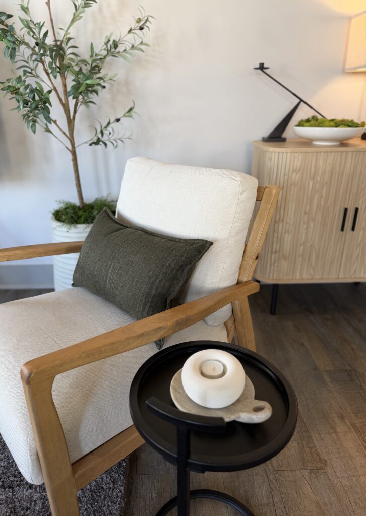 white chair with green pillow