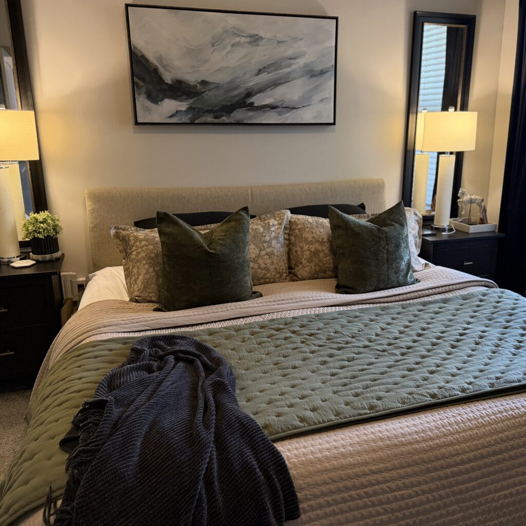 Bedroom with green and black and taupe