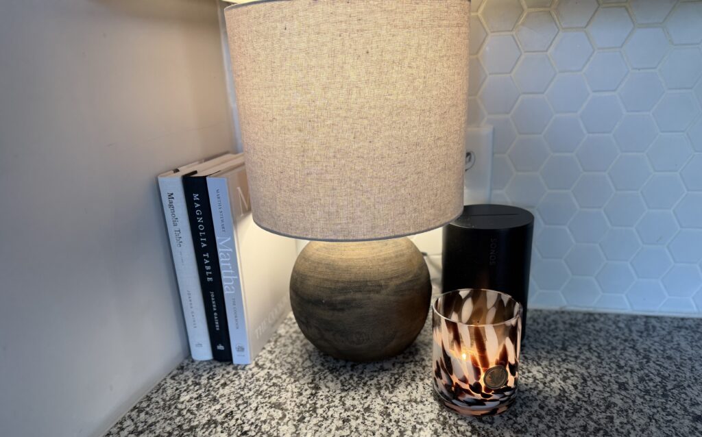 lamp and candle with cookbooks